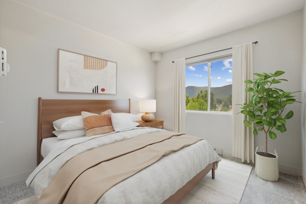 Model bedroom with mountain views