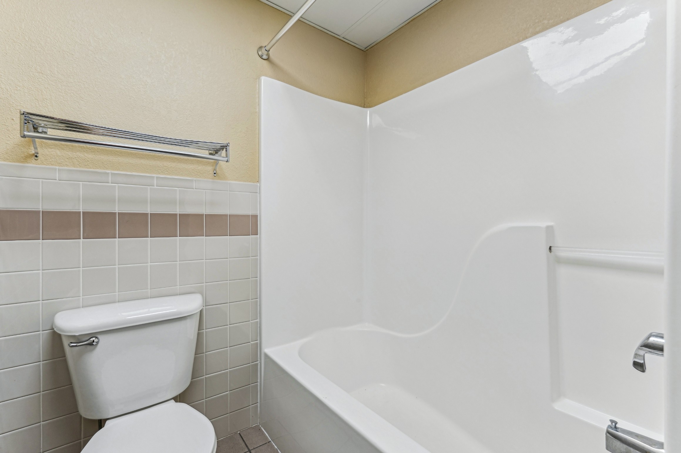 Bathroom with tub shower combination at The House