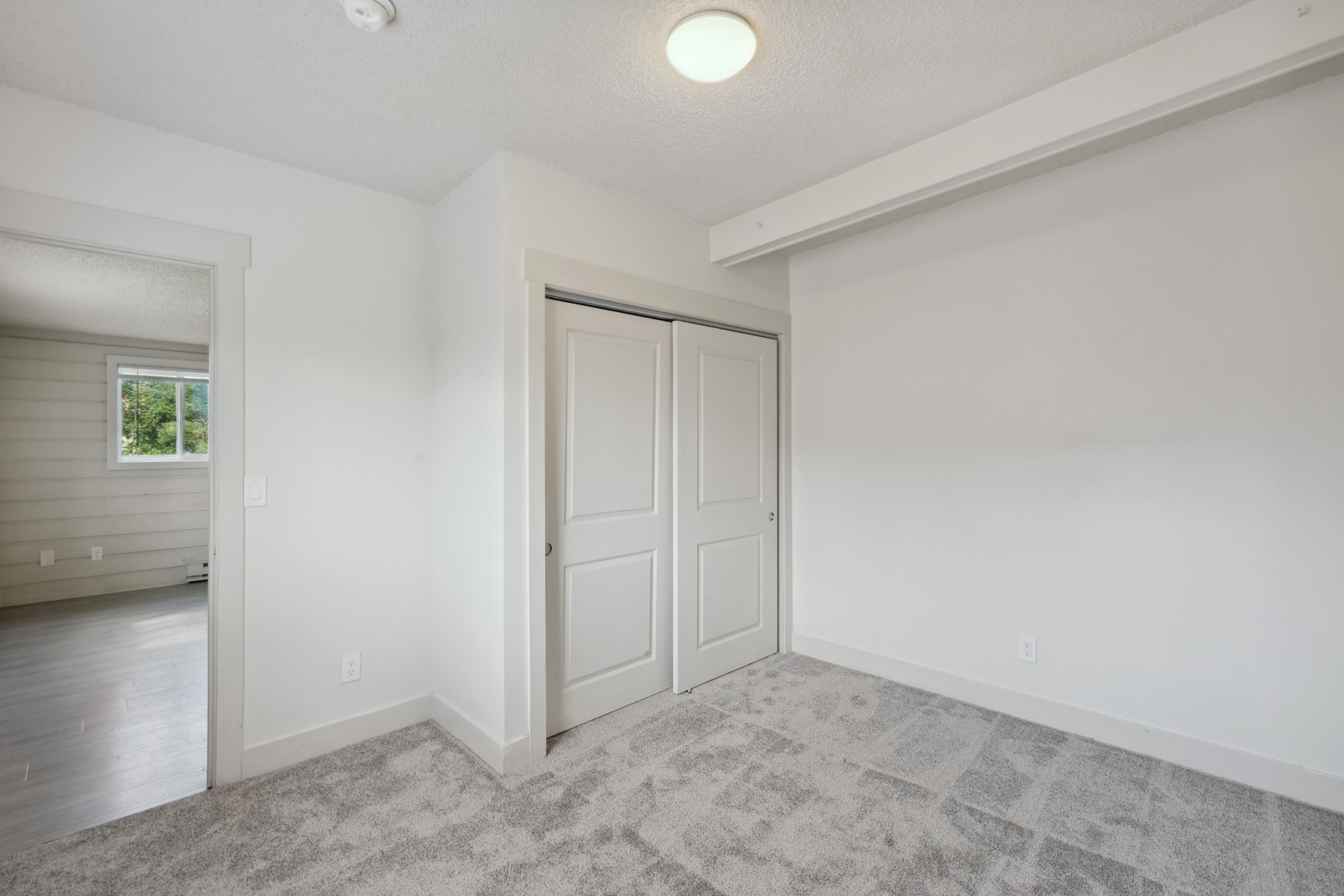 Bedroom with spacious closet at Flats on 2nd