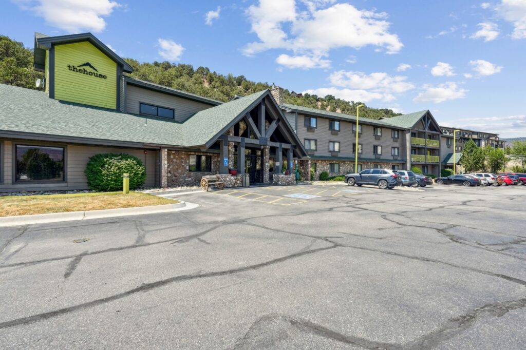 Community exterior and parking at The House Apartments