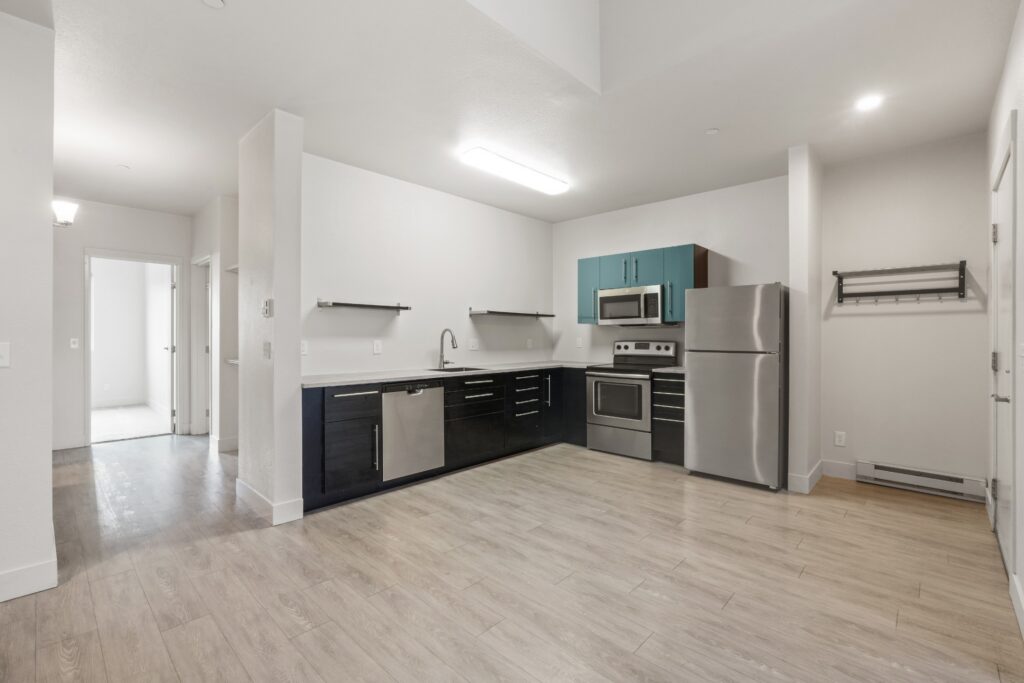 Kitchen and living room of an apartment with modern finishes at Red Table