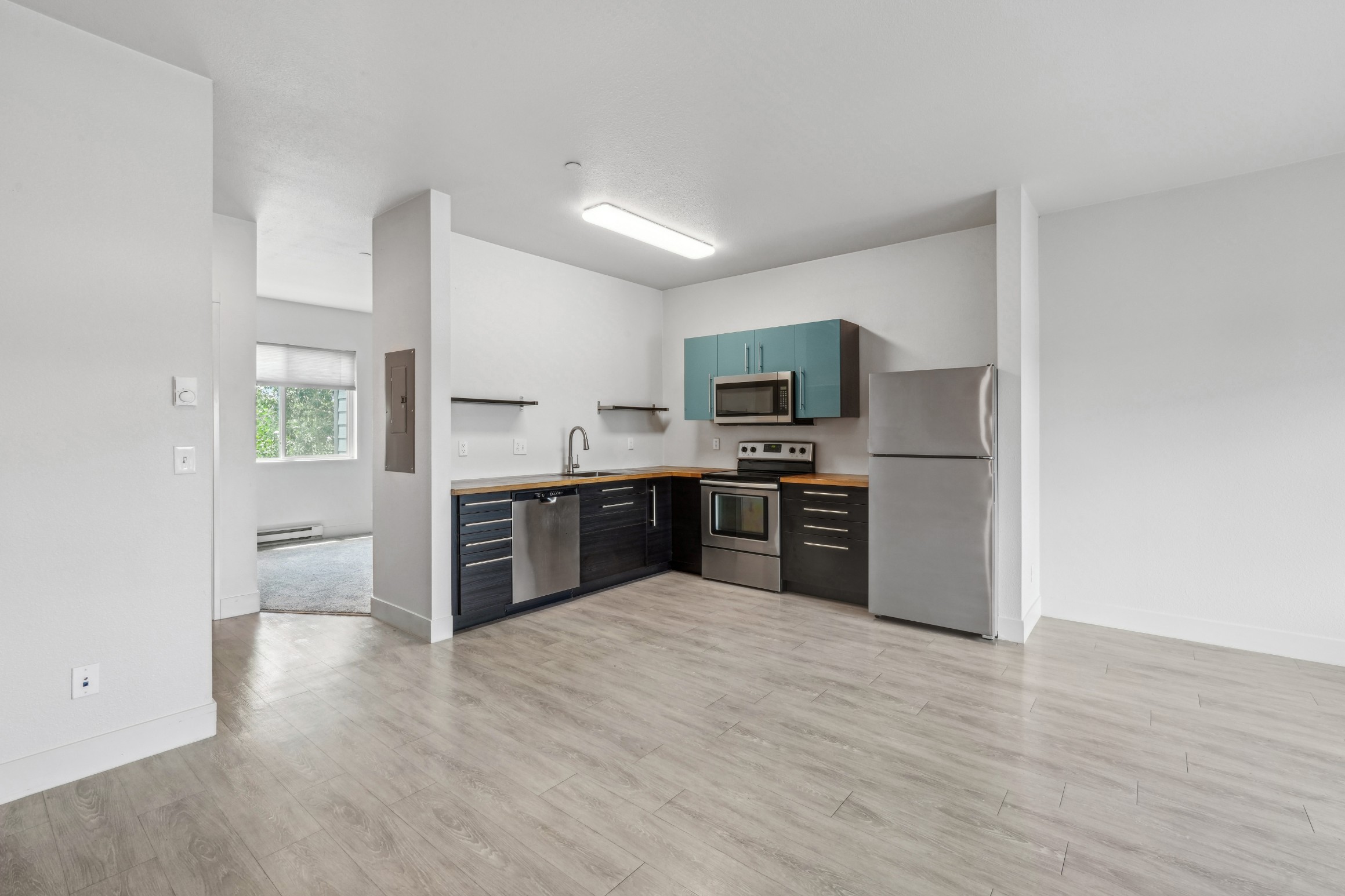 Open apartment kitchen and living area at Red Table Apartments