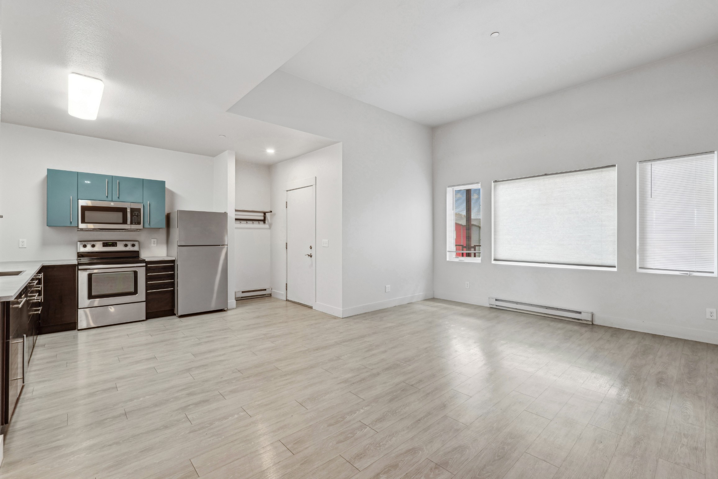 Open kitchen and living area of an apartment at Red Table