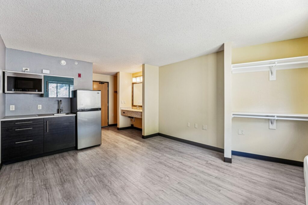 Open kitchen and living area of an apartment at The House