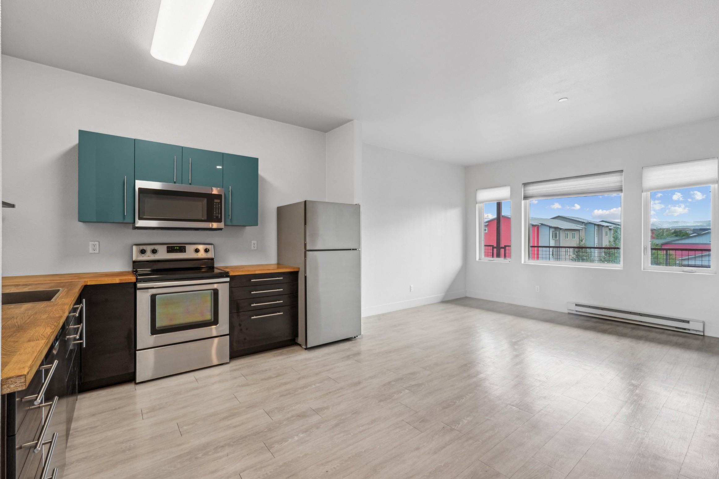 Open modern kitchen and living area at Red Table Apartments