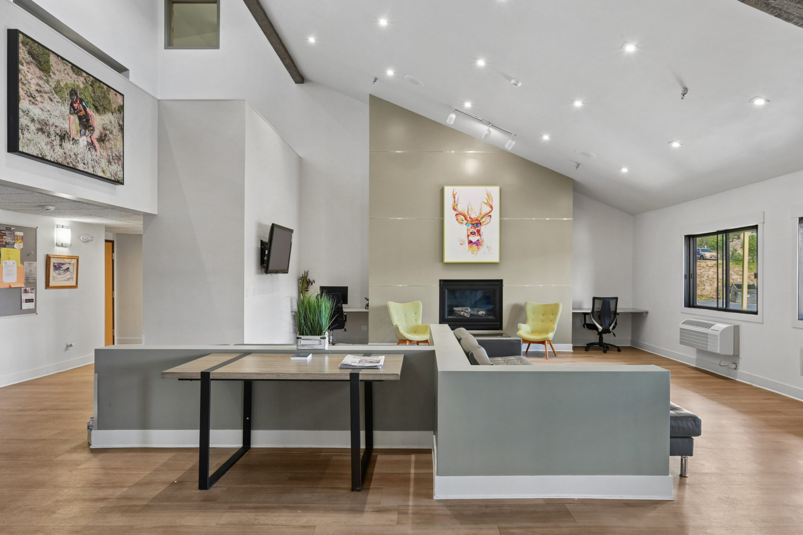 Community clubhouse lounge with workspaces