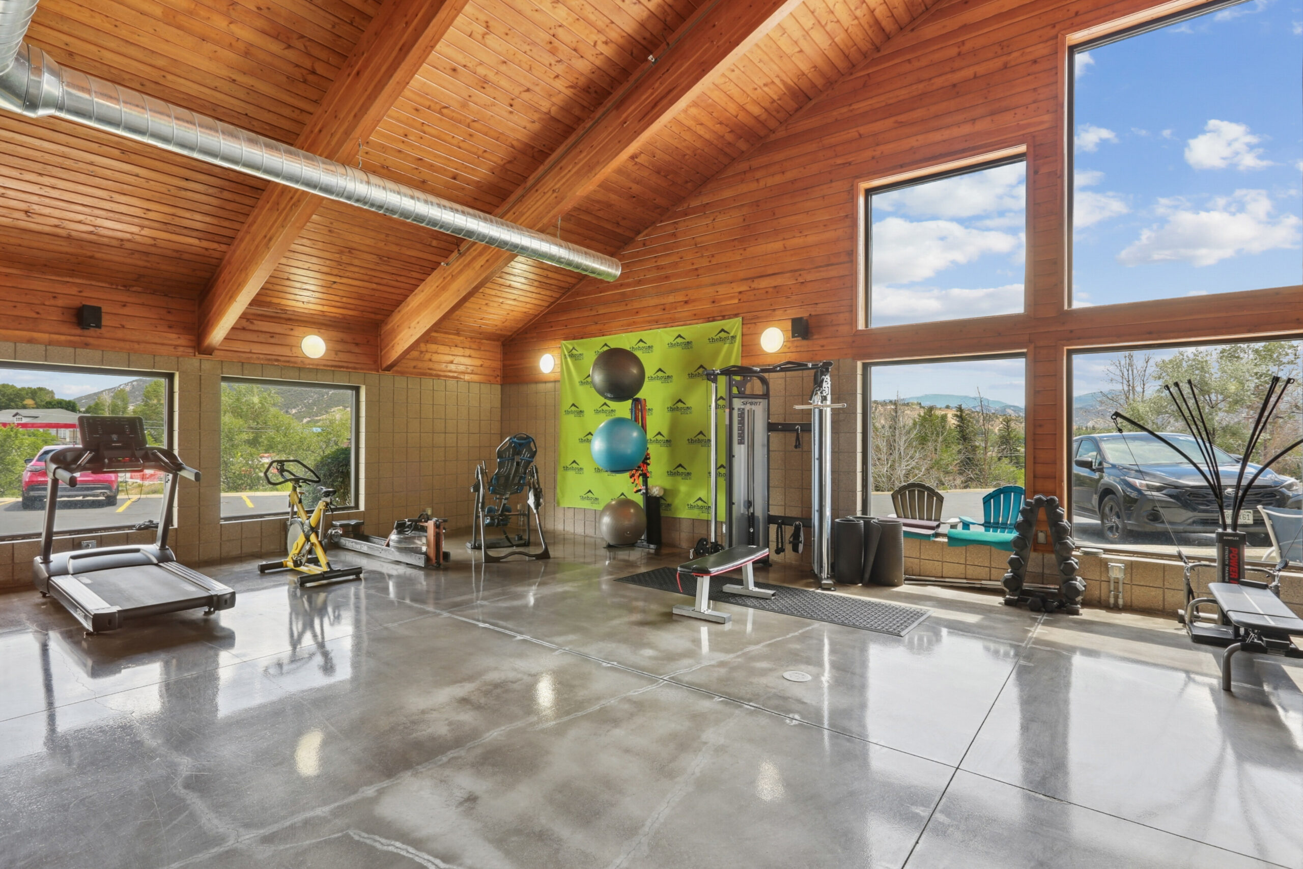 Spacious gym with strength and cardio equipment