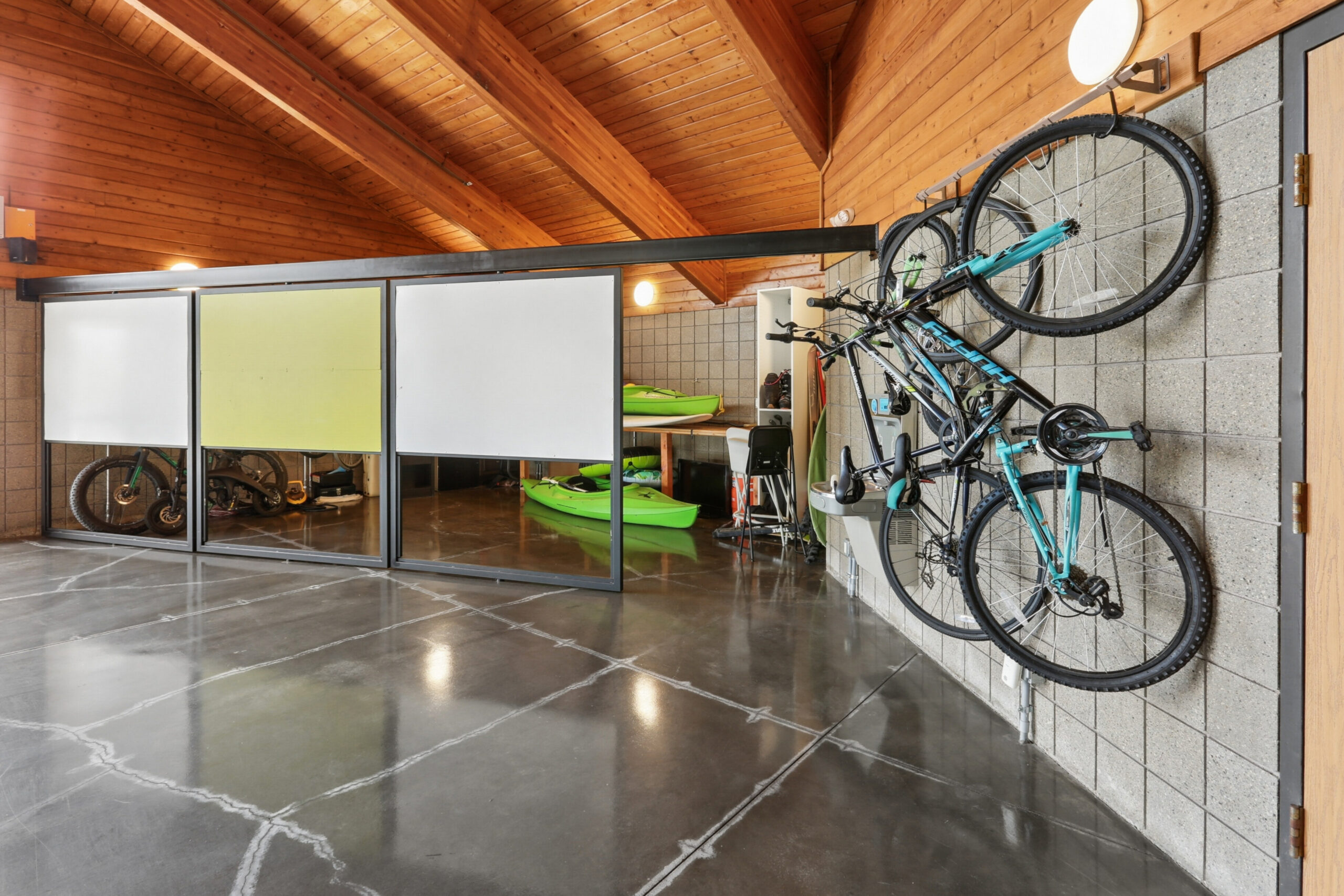 Indoor recreational gear and bike storage at The House