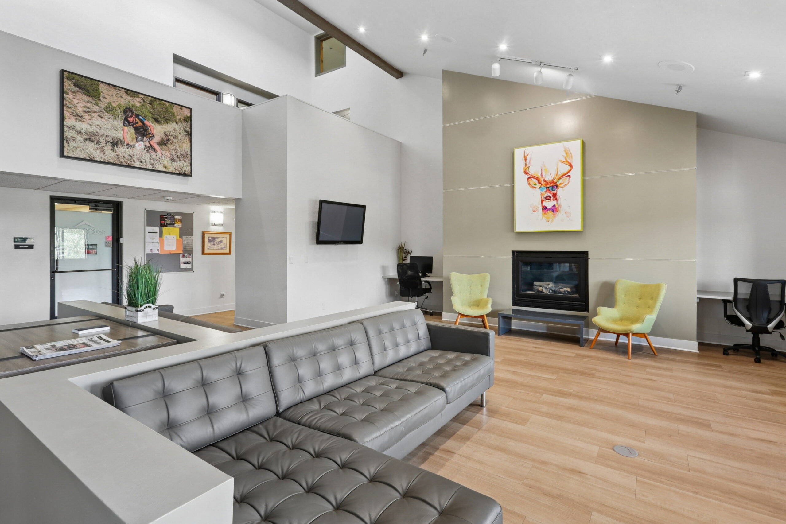 Social lounge with gas fireplace and workspace