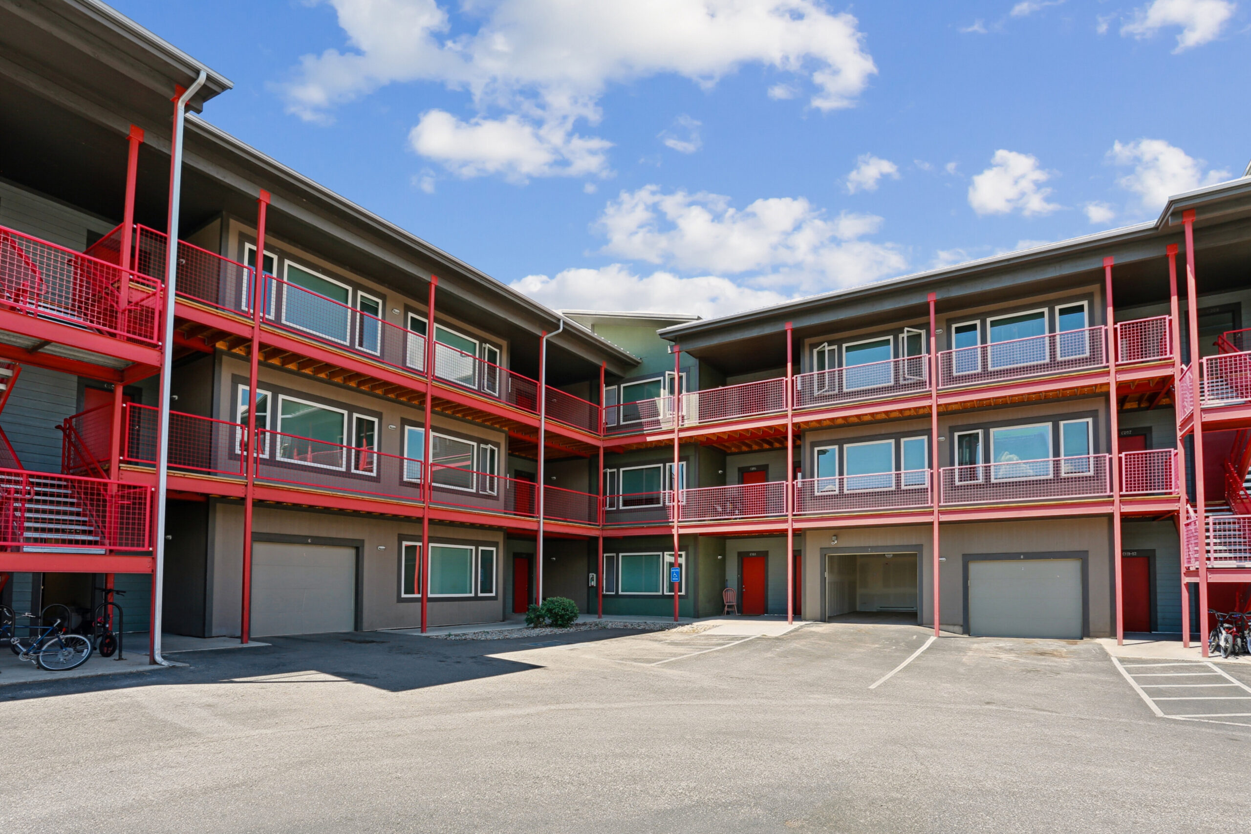 Three story apartment complex with exterior parking
