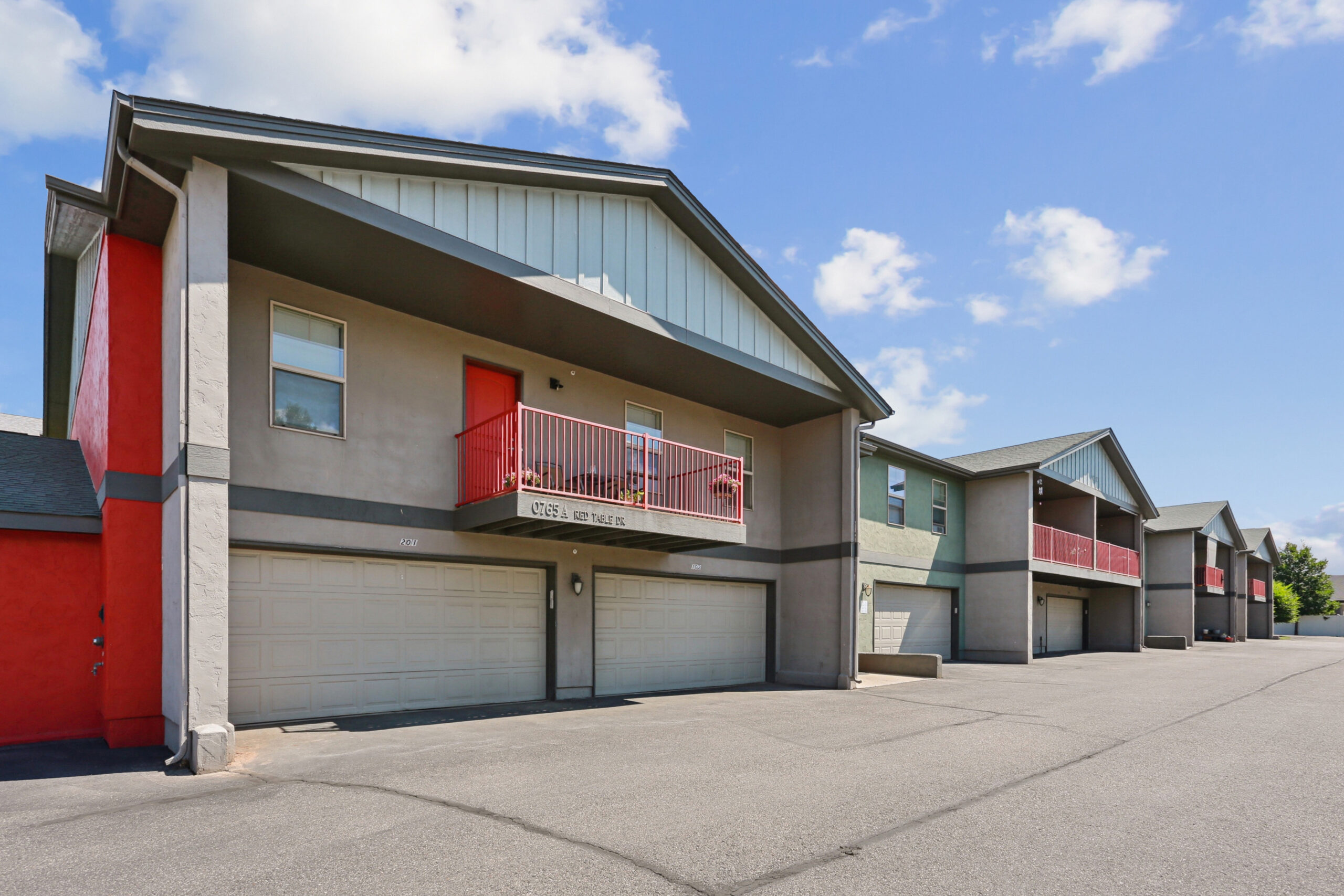 Townhome units with attached garages at Red Table Apartments